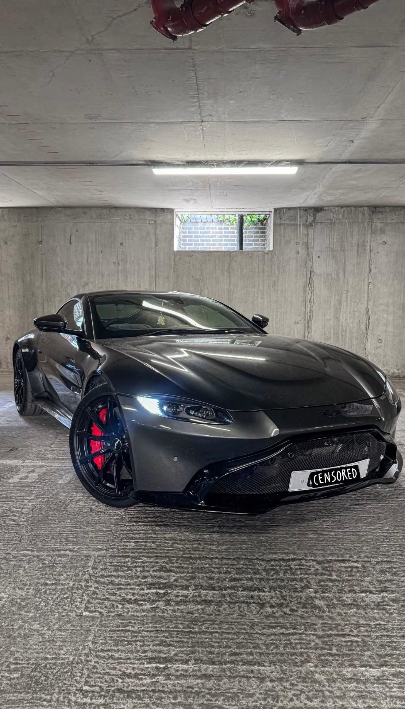 Aston Martin Vantage · front ¾, red calipers